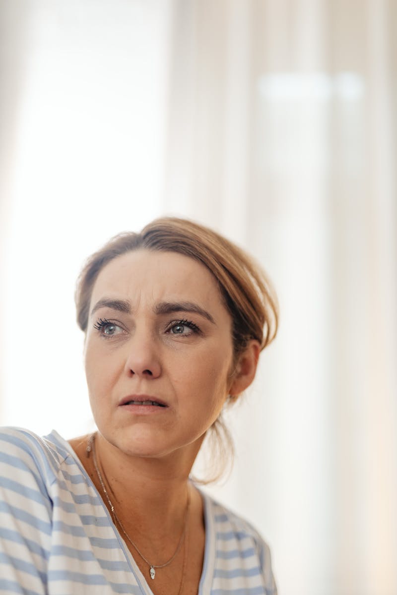 Woman with a worried, distant expression
